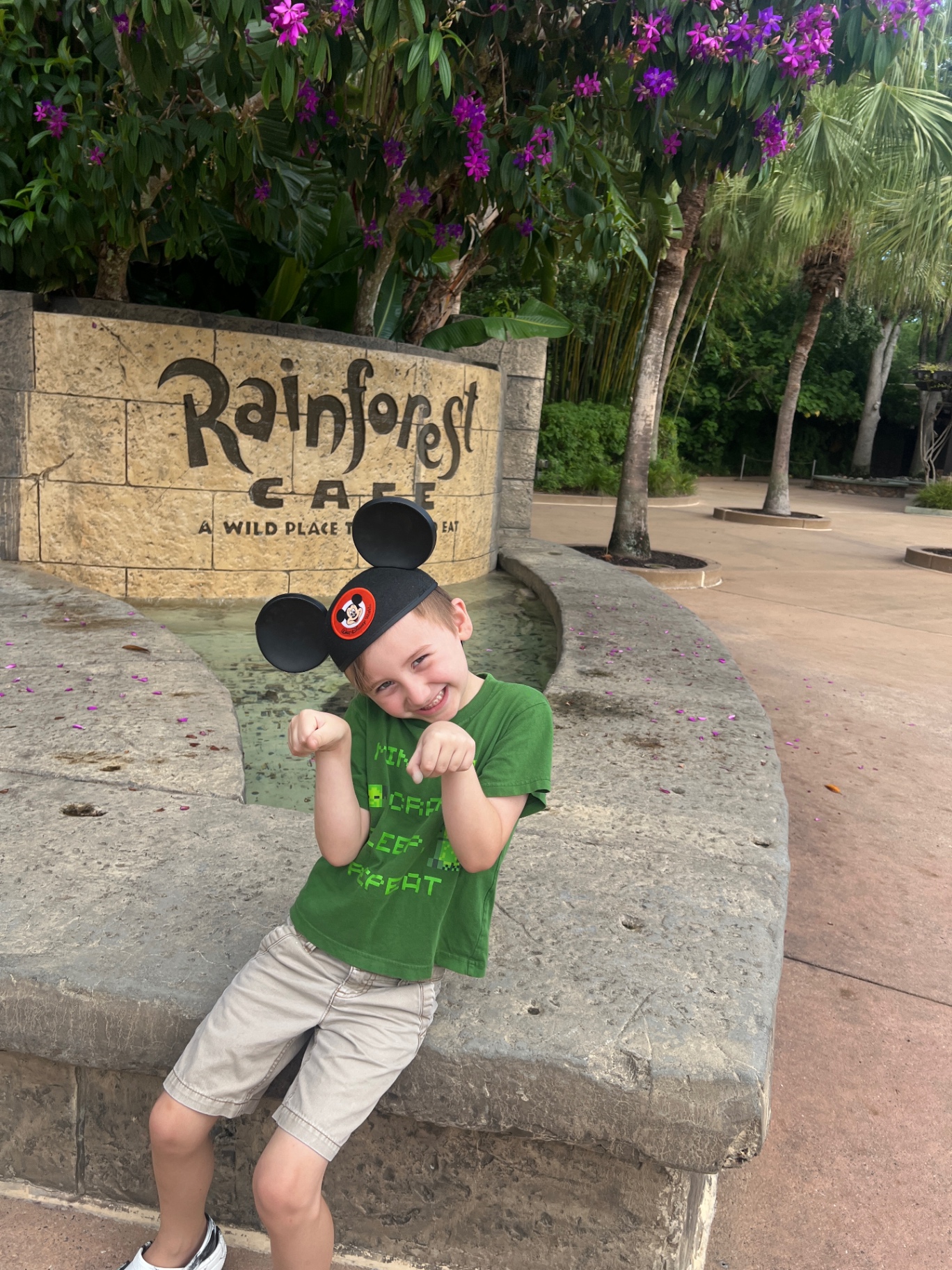 Dalton's son outside the Rainforest Cafe